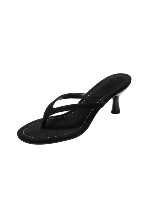 Black sandal with a high heel on a white background